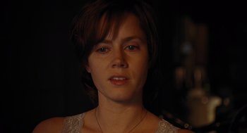 Movie still from “Julie & Julia” (2009), directed by Nora Ephron – A person with short hair; Close Up shot, Over the shoulder angle