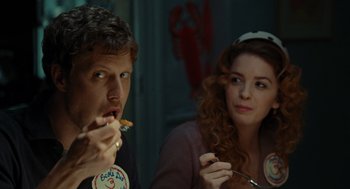 Movie still from “Julie & Julia” (2009), directed by Nora Ephron – A man and a woman sitting next to each other at a table; Close Up shot, Over the shoulder angle