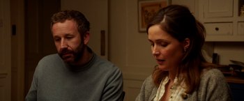 Movie still from “Juliet, Naked” (2018), directed by Jesse Peretz – A man and a woman sitting at a table in a room; Close Up shot, Over the shoulder angle