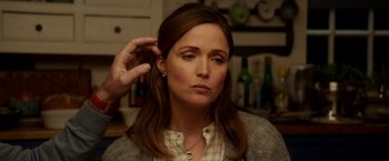 Movie still from “Juliet, Naked” (2018), directed by Jesse Peretz – A person with a hand in their ear; Close Up shot, Over the shoulder angle