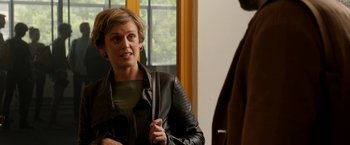 Movie still from “Juliet, Naked” (2018), directed by Jesse Peretz – A woman wearing a leather jacket talking to a man; Close Up shot, Over the shoulder angle