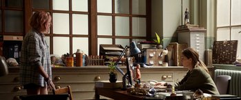 Movie still from “Juliet, Naked” (2018), directed by Jesse Peretz – A desk with a lot of papers on it; Wide shot, High angle