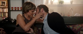 Movie still from “Juliet, Naked” (2018), directed by Jesse Peretz – A man and a woman are kissing in a room; Close Up shot, High angle