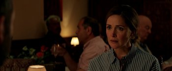 Movie still from “Juliet, Naked” (2018), directed by Jesse Peretz – A person sitting at a table; Close Up shot, Over the shoulder angle