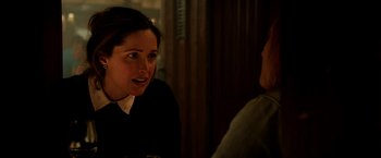 Movie still from “Juliet, Naked” (2018), directed by Jesse Peretz – A woman talking to another woman in a room; Close Up shot, Over the shoulder angle