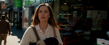 Movie still from “Juliet, Naked” (2018), directed by Jesse Peretz – A woman walking down the street with a purse in her hand; Close Up shot, Over the shoulder angle