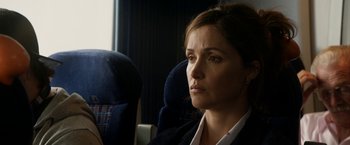 Movie still from “Juliet, Naked” (2018), directed by Jesse Peretz – A woman sitting in a chair on top of a train; Close Up shot, Over the shoulder angle