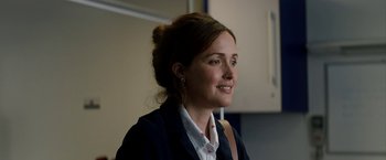 Movie still from “Juliet, Naked” (2018), directed by Jesse Peretz – A person wearing a jacket; Close Up shot, Over the shoulder angle