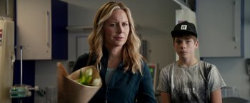 Movie still from “Juliet, Naked” (2018), directed by Jesse Peretz – A woman holding a paper bag of fruit; Close Up shot, Over the shoulder angle