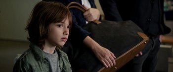Movie still from “Juliet, Naked” (2018), directed by Jesse Peretz – A young boy sitting in front of an older woman; Close Up shot, Over the shoulder angle