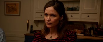 Movie still from “Juliet, Naked” (2018), directed by Jesse Peretz – A person wearing a red and black striped shirt; Close Up shot, Over the shoulder angle