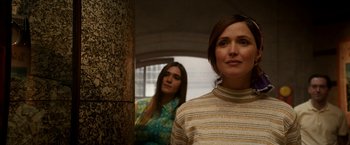 Movie still from “Juliet, Naked” (2018), directed by Jesse Peretz – Two women standing next to each other in a room; Medium shot, Low angle