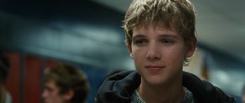 Movie still from “Jumper” (2008), directed by Doug Liman – A person with a beard; Close Up shot, Over the shoulder angle