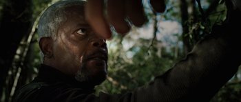 Movie still from “Jumper” (2008), directed by Doug Liman – A man's face with trees in the background; Close Up shot, Low angle