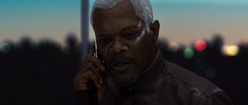 Movie still from “Jumper” (2008), directed by Doug Liman – An older man talking on a cell phone; Close Up shot, High angle