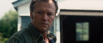 Movie still from “Jumper” (2008), directed by Doug Liman – A person wearing a green shirt; Close Up shot, Over the shoulder angle