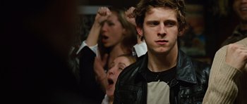 Movie still from “Jumper” (2008), directed by Doug Liman – A group of people that are in a room together; Close Up shot, Over the shoulder angle
