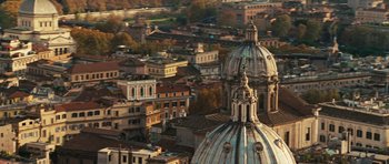 Movie still from “Jumper” (2008), directed by Doug Liman – An aerial view of a city with a church dome; Extreme Wide shot, High angle