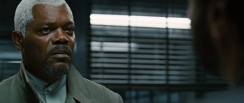 Movie still from “Jumper” (2008), directed by Doug Liman – A person wearing a suit and tie; Close Up shot, Over the shoulder angle
