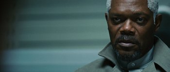 Movie still from “Jumper” (2008), directed by Doug Liman – A man's face with a white beard; Close Up shot, Low angle