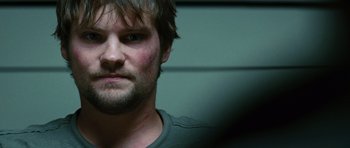 Movie still from “Jumper” (2008), directed by Doug Liman – A person with a beard; Close Up shot, Over the shoulder angle