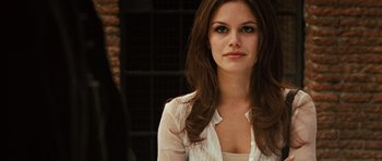 Movie still from “Jumper” (2008), directed by Doug Liman – A beautiful woman with long brown hair wearing a white shirt; Close Up shot, Over the shoulder angle