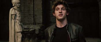 Movie still from “Jumper” (2008), directed by Doug Liman – A man in a black shirt and a leather jacket; Close Up shot, Low angle