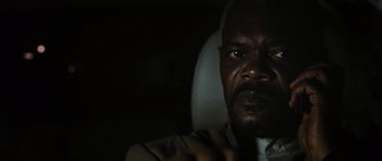 Movie still from “Jumper” (2008), directed by Doug Liman – A man's face in the dark; Close Up shot, Over the shoulder angle