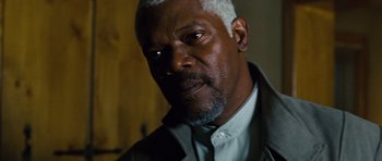 Movie still from “Jumper” (2008), directed by Doug Liman – An older man with white hair looking at the camera; Close Up shot, Over the shoulder angle