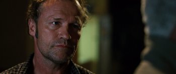 Movie still from “Jumper” (2008), directed by Doug Liman – A person wearing a plaid shirt; Close Up shot, Over the shoulder angle