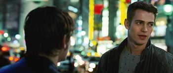 Movie still from “Jumper” (2008), directed by Doug Liman – Two people standing in front of a city lit up at night; Close Up shot, Over the shoulder angle