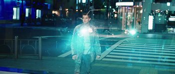 Movie still from “Jumper” (2008), directed by Doug Liman – A man standing on a street at night with a flashlight; Medium shot, Low angle
