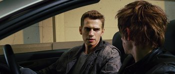 Movie still from “Jumper” (2008), directed by Doug Liman – A man sitting in the back seat of a car; Close Up shot, Over the shoulder angle