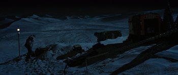 Movie still from “Jumper” (2008), directed by Doug Liman – A person is standing on a hill at night; Extreme Wide shot, High angle