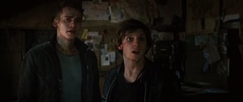 Movie still from “Jumper” (2008), directed by Doug Liman – Two young men standing next to each other in front of a wall; Close Up shot, Low angle
