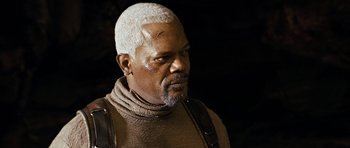 Movie still from “Jumper” (2008), directed by Doug Liman – An older man with white hair is wearing a brown sweater; Close Up shot, High angle