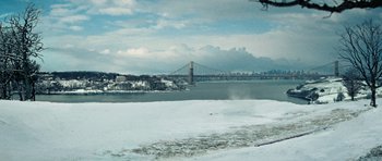 Movie still from “Jumper” (2008), directed by Doug Liman – A view of a bridge from the water; Extreme Wide shot, High angle