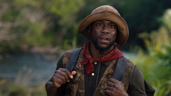 Movie still from “Jumanji: Welcome to the Jungle” (2017), directed by Jake Kasdan – A man with a hat and a backpack; Close Up shot, Low angle