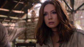 Movie still from “Jumanji: Welcome to the Jungle” (2017), directed by Jake Kasdan – A person with long brown hair; Close Up shot, Over the shoulder angle