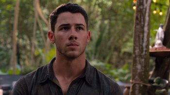 Movie still from “Jumanji: Welcome to the Jungle” (2017), directed by Jake Kasdan – A person wearing a brown shirt; Close Up shot, Over the shoulder angle