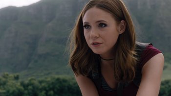 Movie still from “Jumanji: Welcome to the Jungle” (2017), directed by Jake Kasdan – A beautiful young woman with long brown hair and green eyes; Close Up shot, Over the shoulder angle