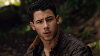 Movie still from “Jumanji: Welcome to the Jungle” (2017), directed by Jake Kasdan – A person wearing a leather jacket; Close Up shot, High angle