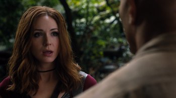 Movie still from “Jumanji: Welcome to the Jungle” (2017), directed by Jake Kasdan – A red headed woman talking to a man in the woods; Close Up shot, Over the shoulder angle