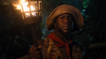Movie still from “Jumanji: Welcome to the Jungle” (2017), directed by Jake Kasdan – A man holding a lantern in the dark; Close Up shot, Low angle