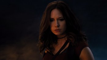 Movie still from “Jumanji: Welcome to the Jungle” (2017), directed by Jake Kasdan – A beautiful woman with long brown hair wearing a red shirt; Close Up shot, Low angle