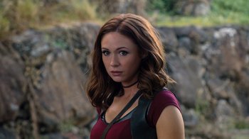 Movie still from “Jumanji: Welcome to the Jungle” (2017), directed by Jake Kasdan – A beautiful woman with long brown hair wearing a red shirt; Close Up shot, High angle