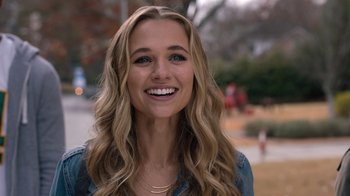 Movie still from “Jumanji: Welcome to the Jungle” (2017), directed by Jake Kasdan – A beautiful young lady smiling for the camera; Close Up shot, Over the shoulder angle
