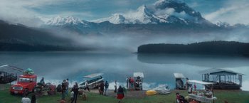 Movie still from “Jungle” (2017), directed by Greg McLean – A group of people standing near a body of water; Extreme Wide shot, High angle