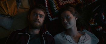 Movie still from “Jungle” (2017), directed by Greg McLean – A man and a woman sitting next to each other; Close Up shot, Over the shoulder angle