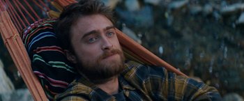 Movie still from “Jungle” (2017), directed by Greg McLean – A person with a beard; Close Up shot, Overhead angle